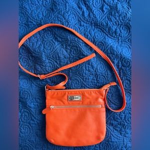Like new Izod orange shoulder purse.  Inside is blue.  Great for fall.